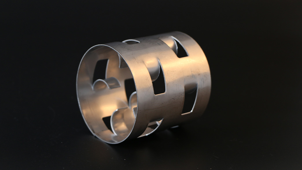 Close-up of stainless steel Pall Ring showing punched windows and inward-bent fingers